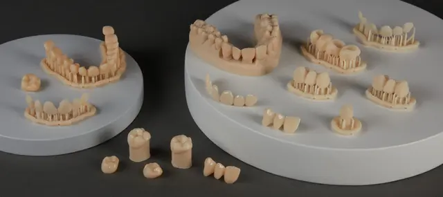 Parts printed with BEGO™ VarseoSmileⓇ TriniQⓇ Resin including veneers, crowns, and three-unit bridges