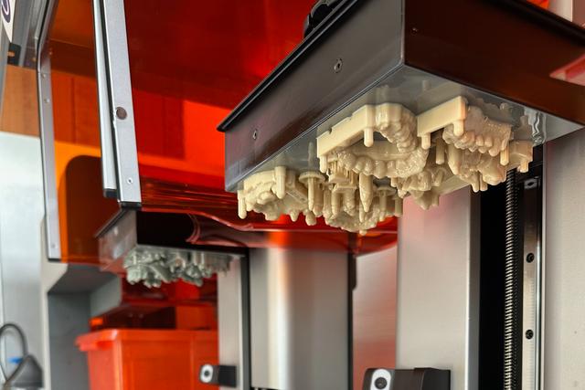 Dental models on a build platform in a Form 4B 3D printer