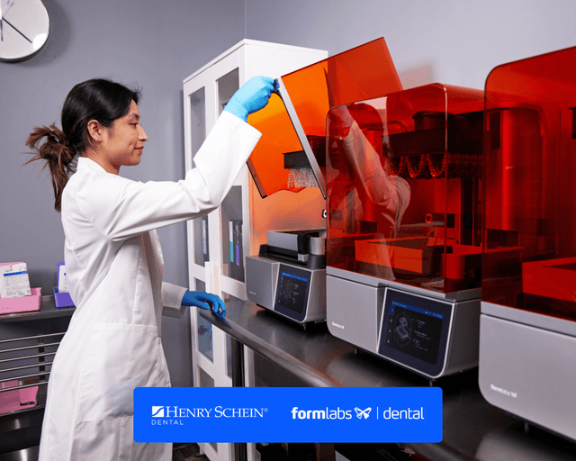 Person lifting cover of Form 4B 3D printer