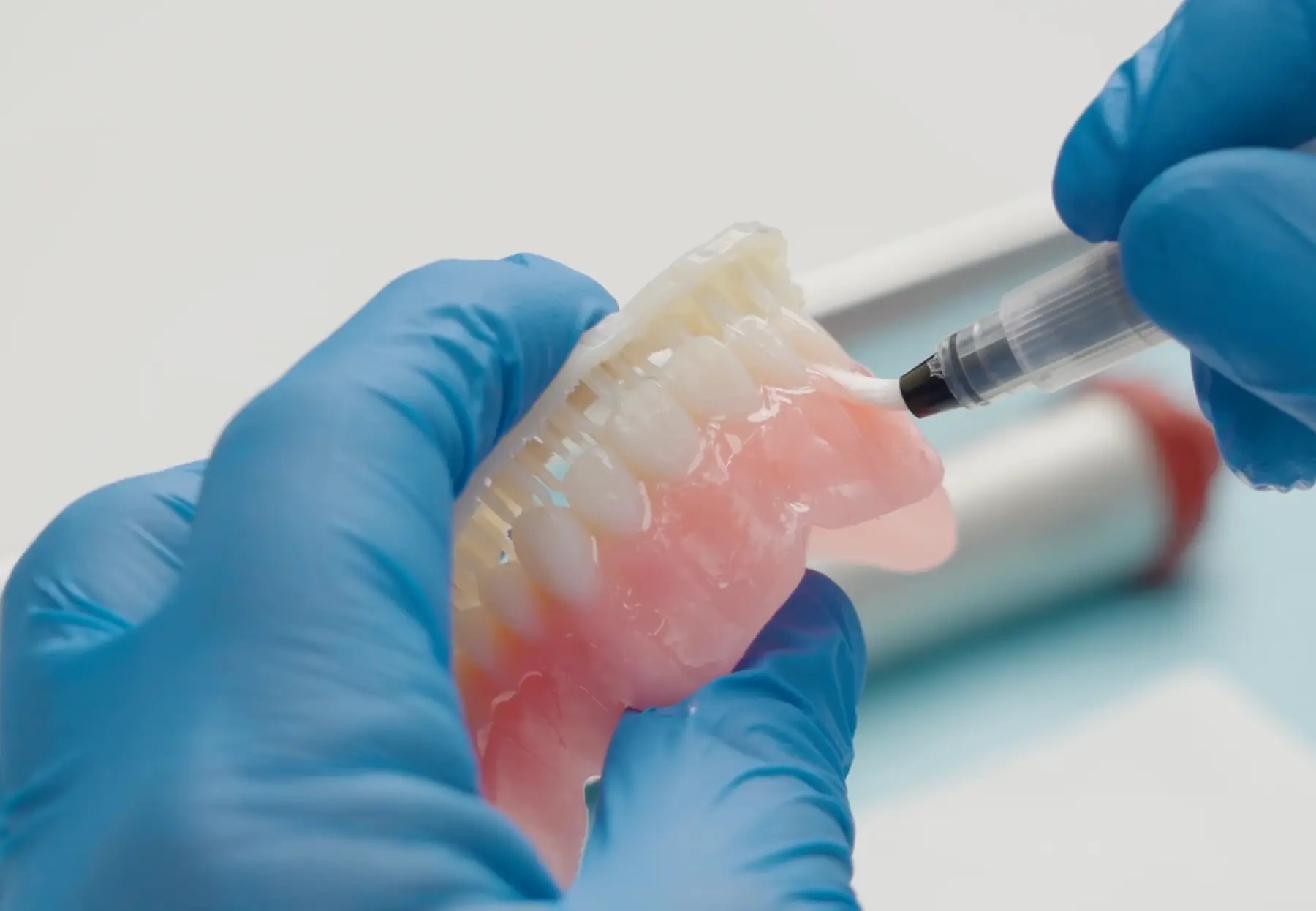 removing any excess liquid resin