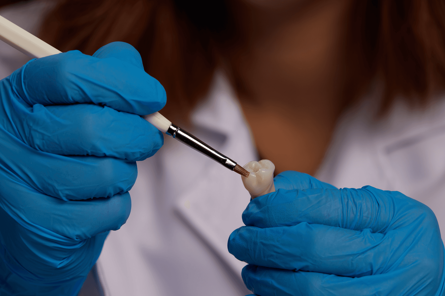 Person wearing gloves characterizing restoration