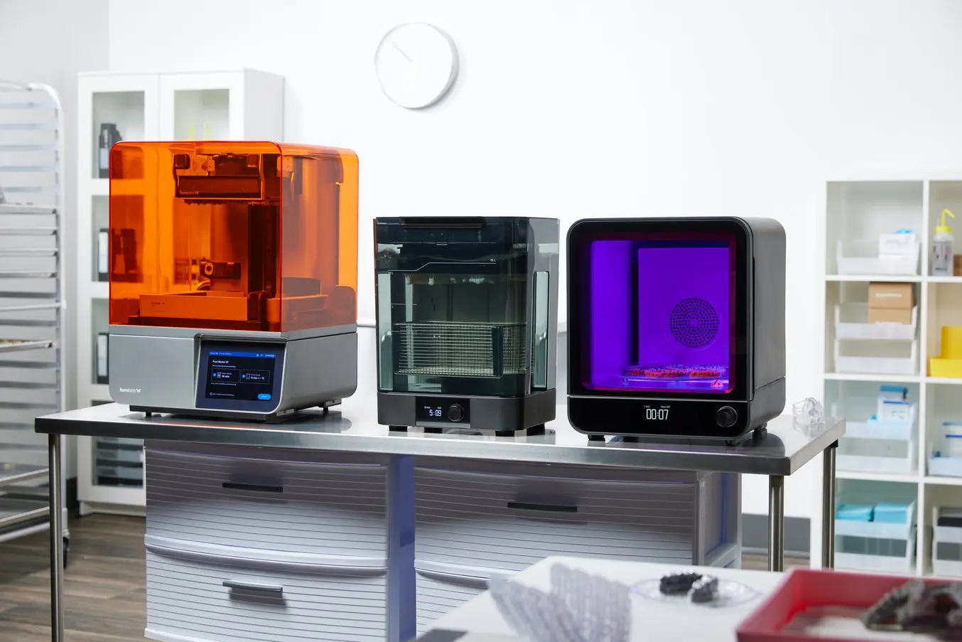 Table in dental lab with a Form 4B, Form Wash (2nd Generation), and Form Cure (2nd Generation)