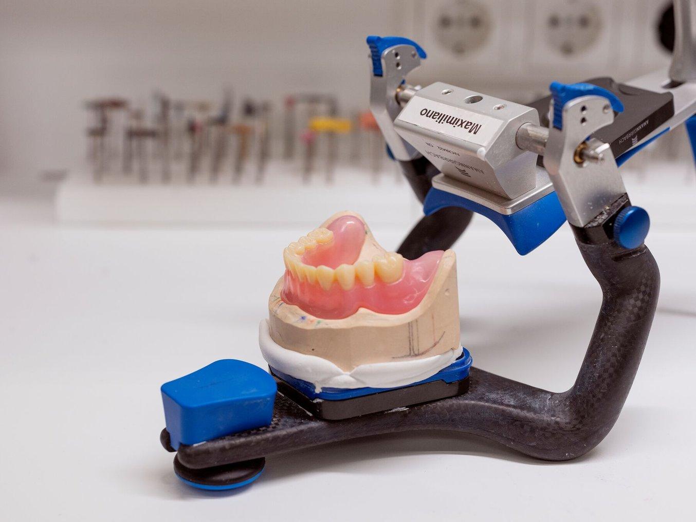 A finished, 3D printed mandibular denture