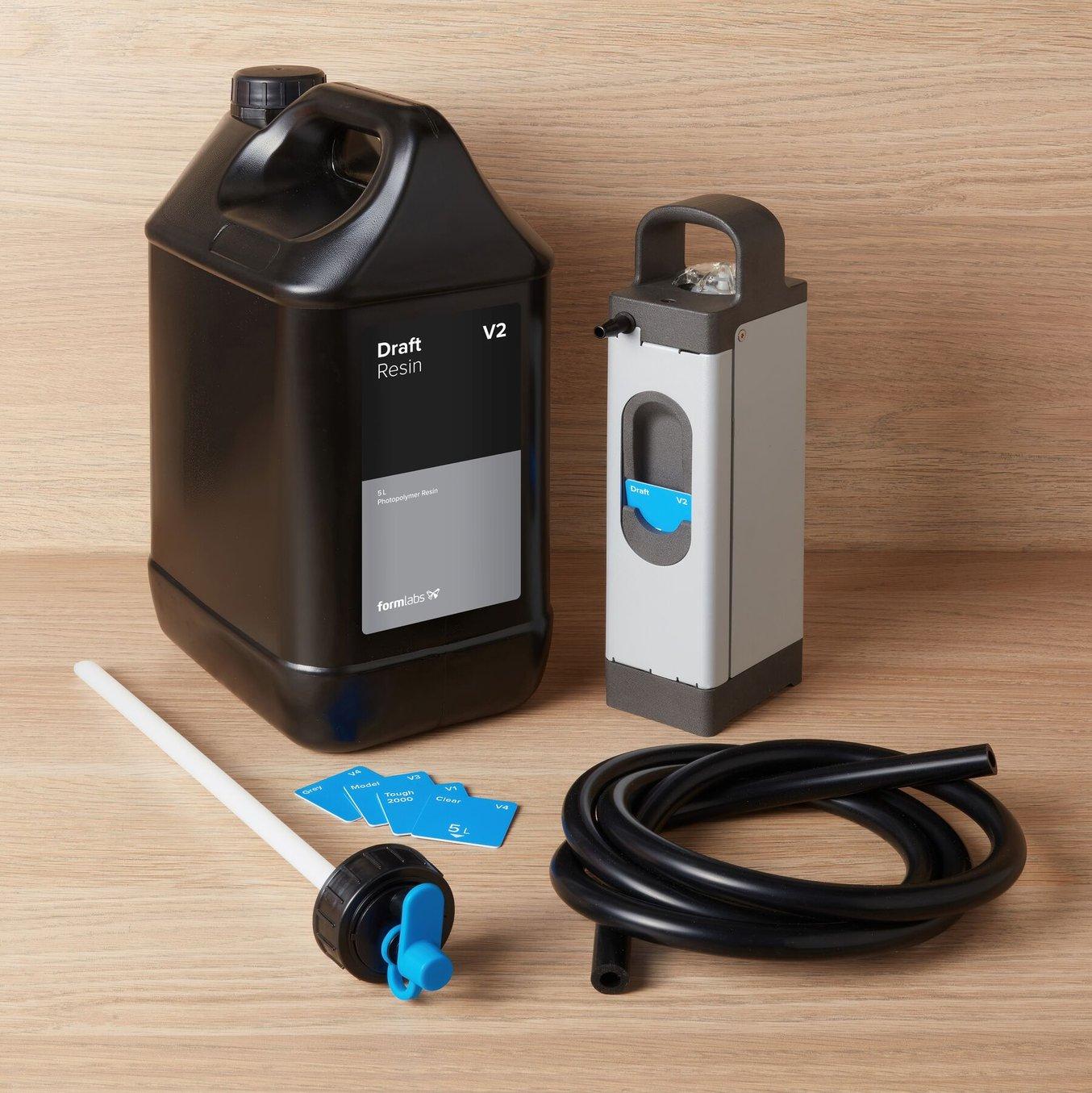 The Resin Pumping System including a 5 L Container of Draft Resin, tube, and card