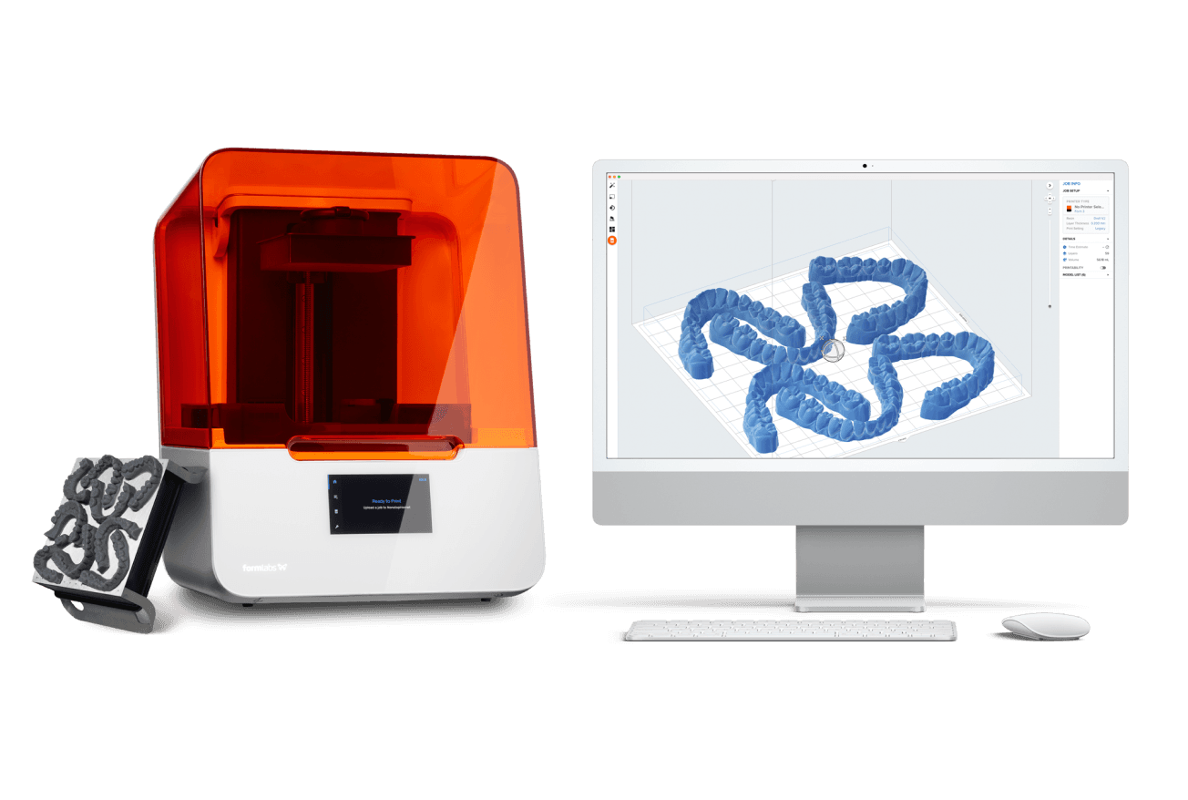The Formlabs Form 3B 3D printer next to a desktop monitor showing PreForm