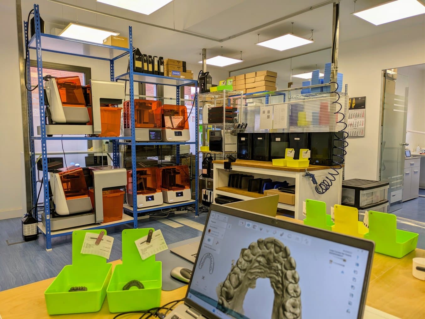 Interior of a dental lab including Formlabs 3D printers, Form Washes, and Form Cures