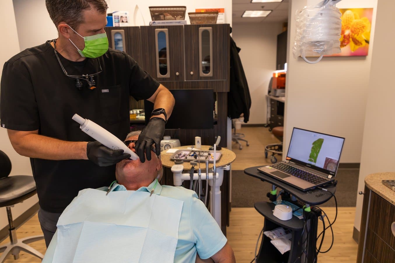 Dr. Baer scanning a patient with an intraoral scanner