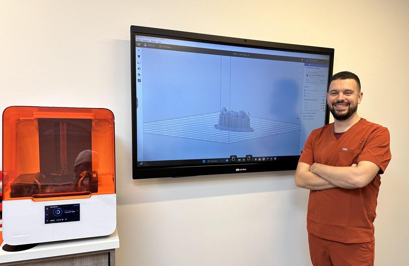 Dr. Lanoiselee stands in front of a screen showing a 3D model and next to a Form 3B+ 3D printer