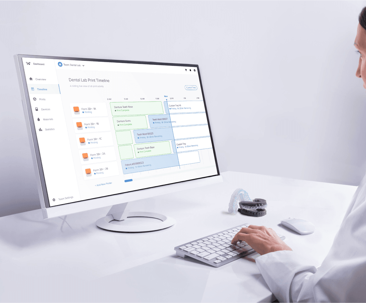 Formlabs dental expert sitting at a computer with Dashboard open