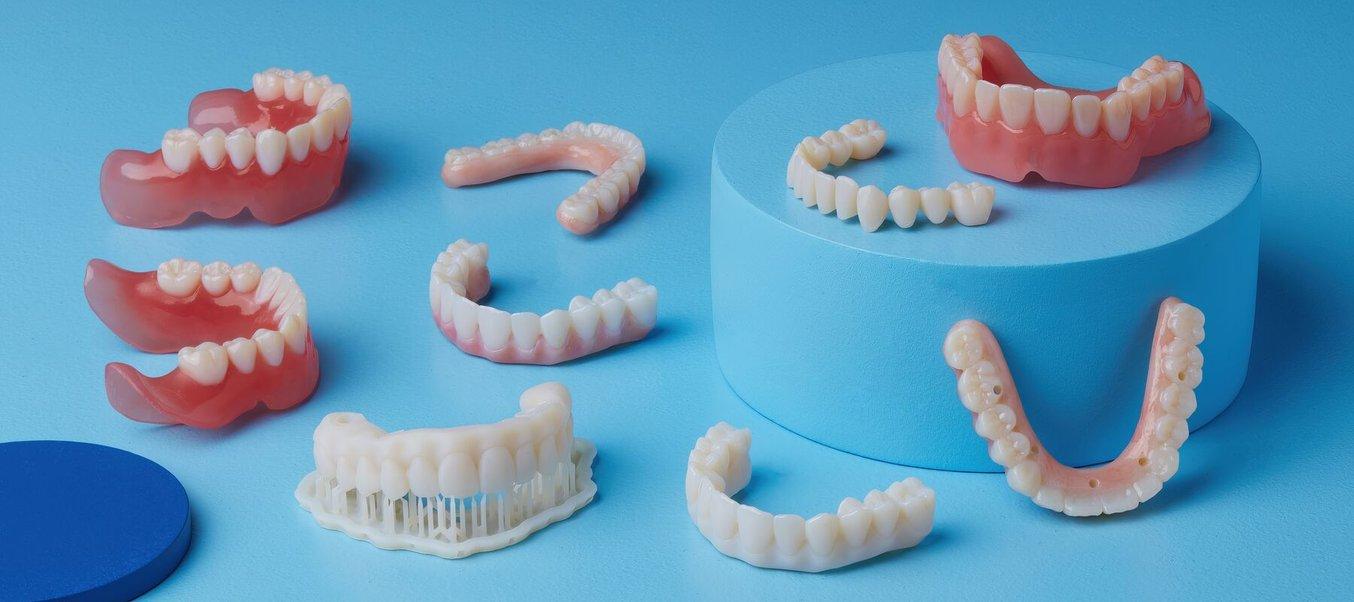 3D printed dentures and All-on-X on a blue background
