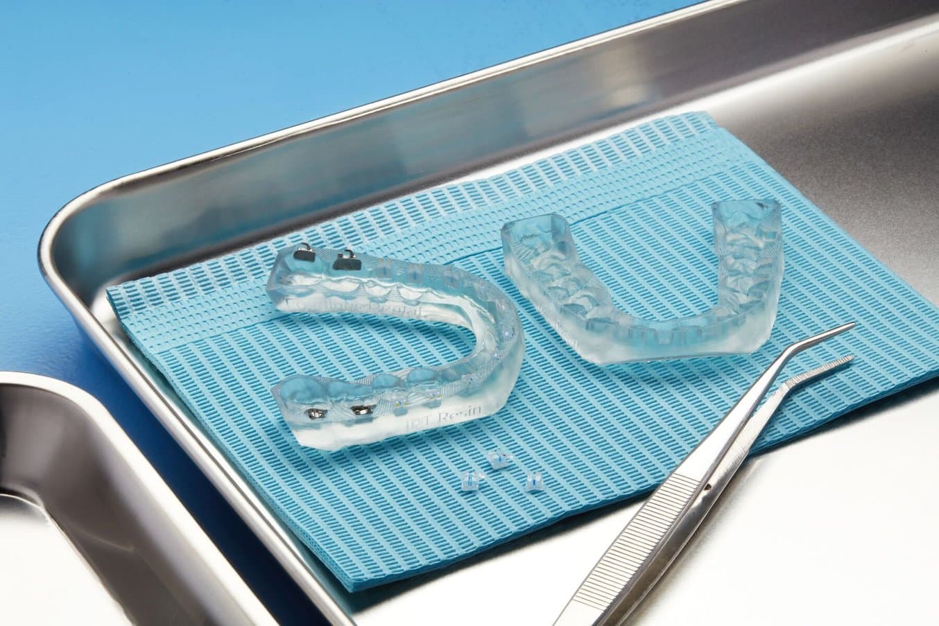 Indirect bonding trays with some brackets seeded