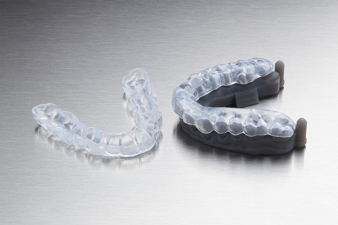 Finished occlusal splint printed in Dental LT Clear Resin, on a diagnostic model.