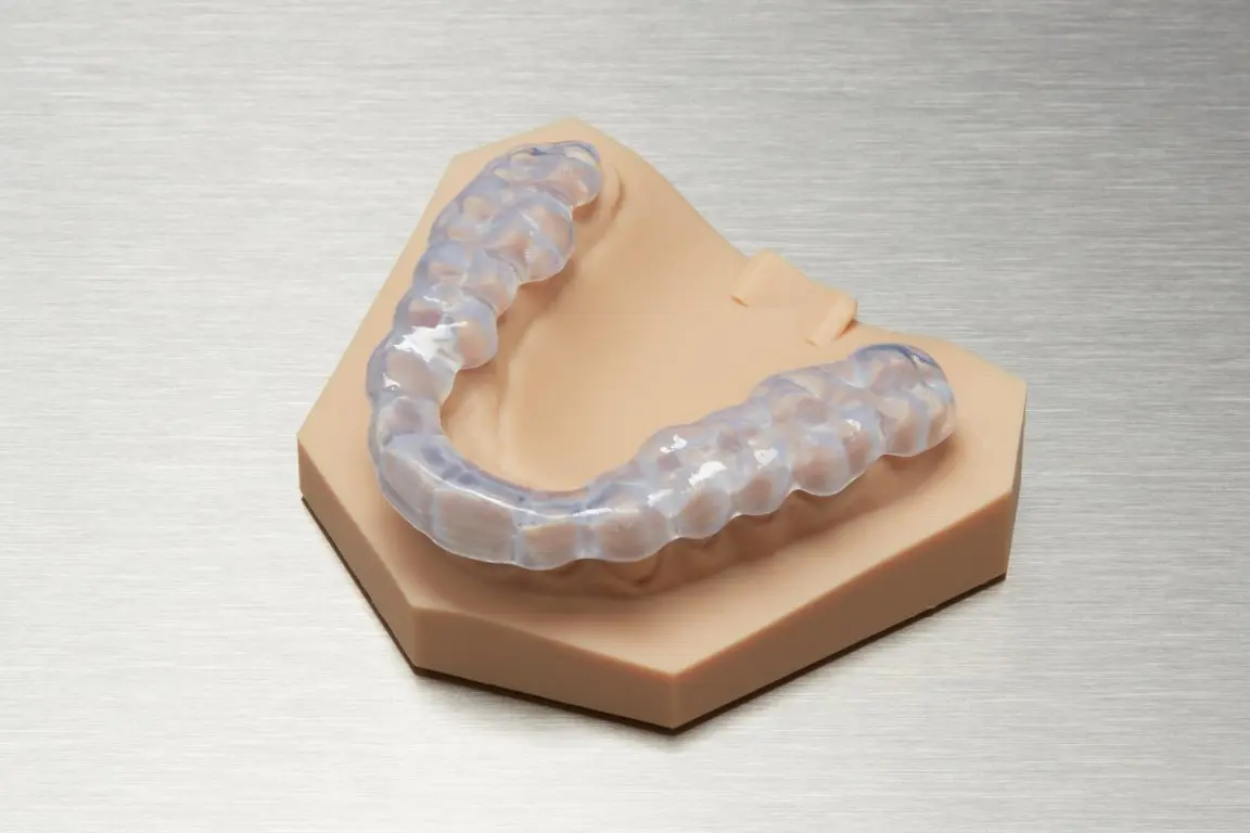 Finished occlusal splint printed in Dental LT Clear Resin, on a diagnostic model.
